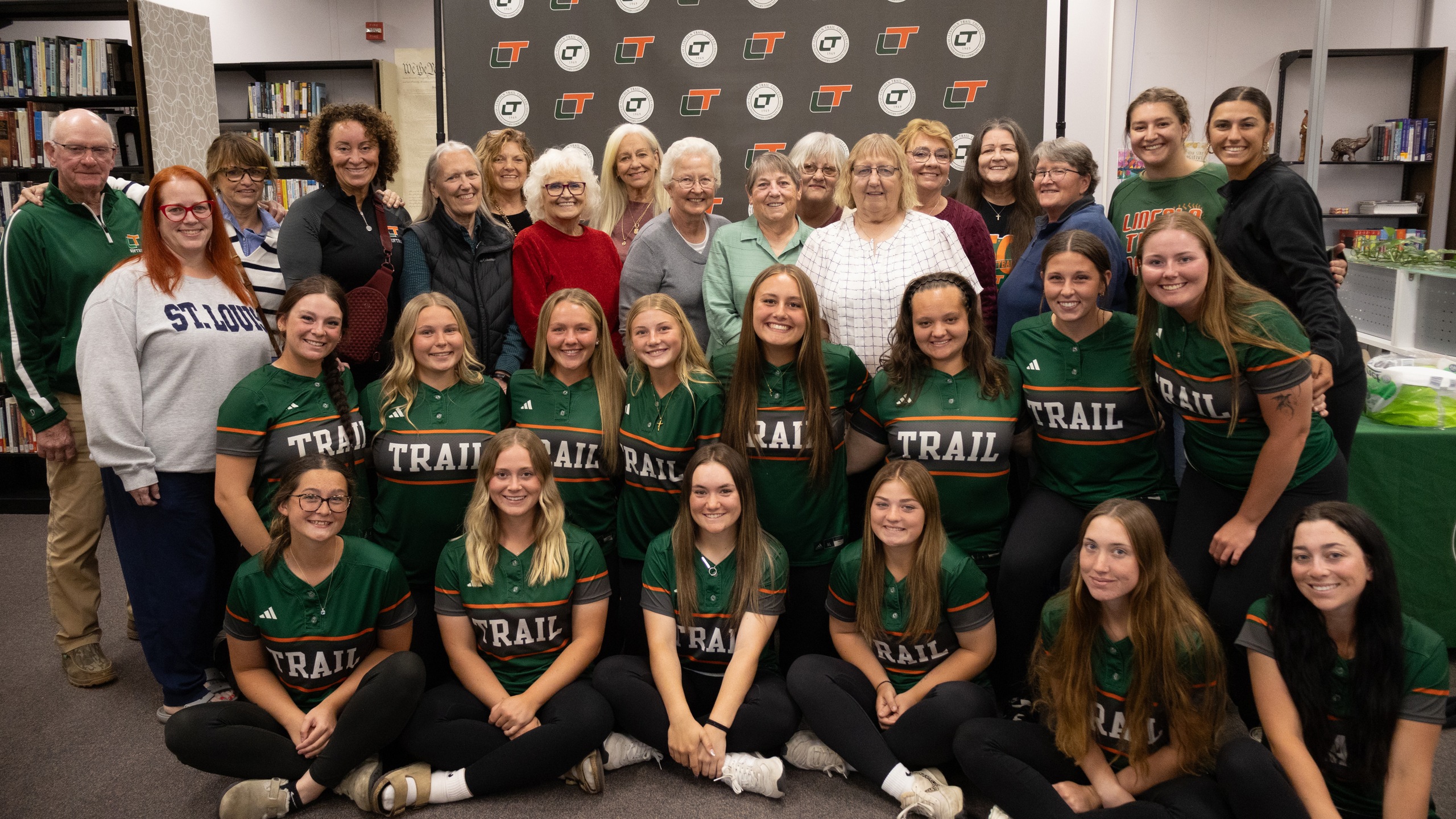 Lincoln Trail College softball alumni and current players pose for a group photo during the college&rsquo;s Softball Alumni Recognition event celebrating 50 years of LTC softball.